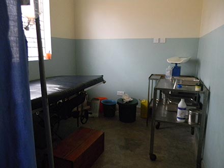 A stark medical treatment room in Uganda