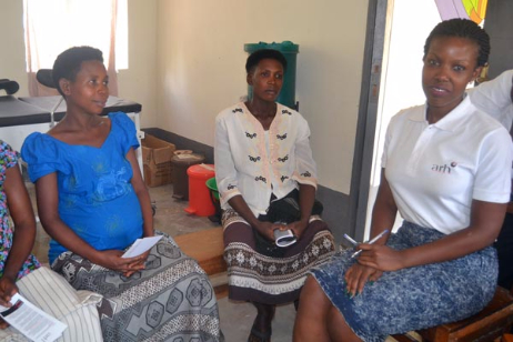 Consulting with local women at the Nyabushenyi Health Center